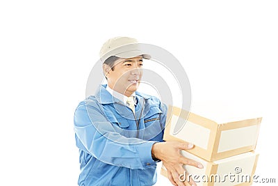 Asian courier delivering a package Stock Photo