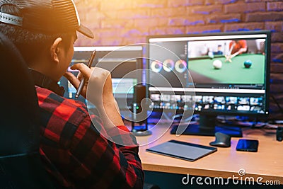 Asian creative man and editor video work Vlogger editing video create content for upload on social media or internet online Stock Photo