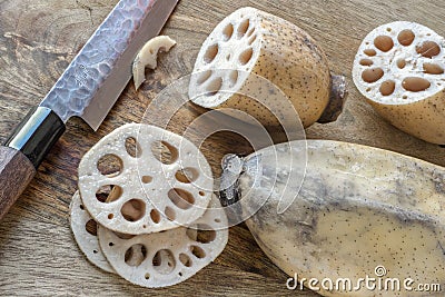 Fresh raw lotus roots, partly sliced Stock Photo