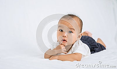 asian cute baby boy on white bed Stock Photo