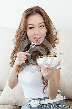 Asian cute girl eating Salad Stock Photo