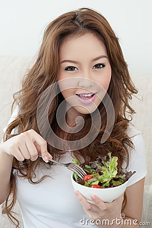 Asian cute girl eating Salad Stock Photo