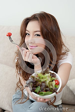 Asian cute girl eating Salad Stock Photo