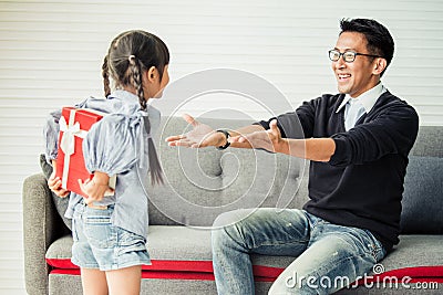 Asian daughter give present for father. concept surprise gift box Stock Photo