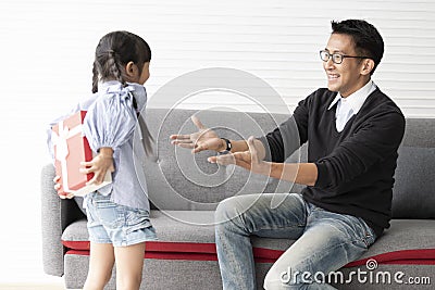 Asian daughter give present for father. concept surprise gift box for birthday Stock Photo