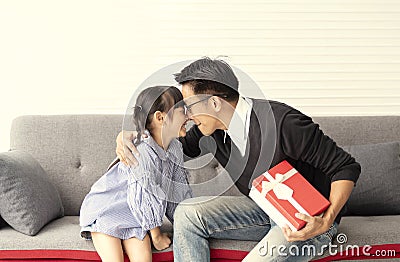 Asian daughter give present for father. concept surprise gift box for birthday Stock Photo