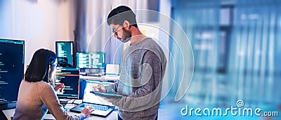 asian developer discussion about ai programing coding project in the night at office Stock Photo