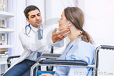 Asian doctor check-up pretty patient for her Thyroid hormones healthy at hospital or medical clinic Stock Photo