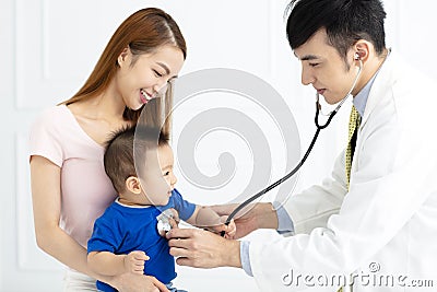 Doctor examining little boy by stethoscope Stock Photo