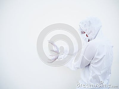 Asian doctor or scientist in PPE suite uniform showing unleash the power by hand with copy space on a white background. Stock Photo