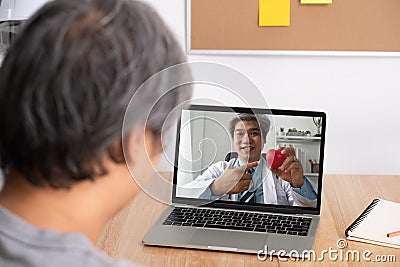 Asian doctor or therapist help relieve stress and provide knowledge and understanding about heart disease to patients video Stock Photo