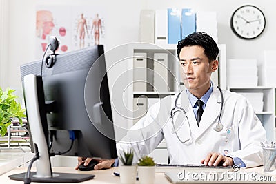 Asian doctor work in clinic Stock Photo