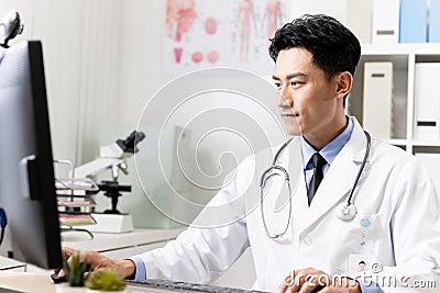 Asian doctor work in clinic Stock Photo