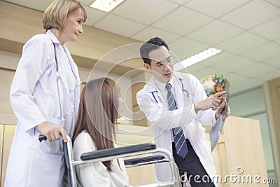 Asian doctors examine the patient`s most previous scans Stock Photo