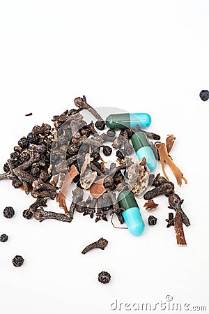 Asian dry herbals medicine and drug capsule medicine on white background Stock Photo