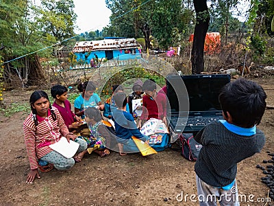 asian kids learning about laptop computer system at open area class in india January 2020 Editorial Stock Photo