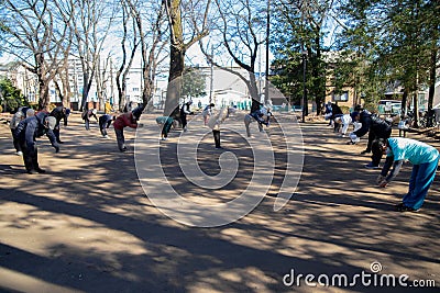 Asian elderly people practicing Tai Chi at public park Editorial Stock Photo