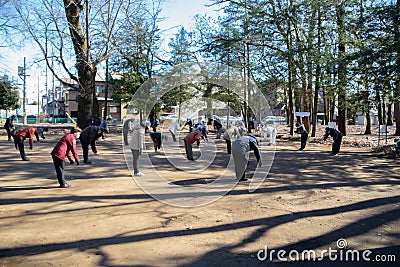 Asian elderly people practicing Tai Chi at public park Editorial Stock Photo