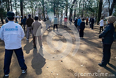 Asian elderly people practicing Tai Chi at public park Editorial Stock Photo
