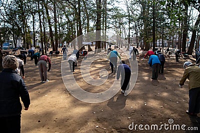 Asian elderly people practicing Tai Chi at public park Editorial Stock Photo