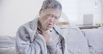 Elderly man has sore throat Stock Photo
