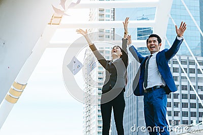 Asian employees celebrating achievement success Stock Photo