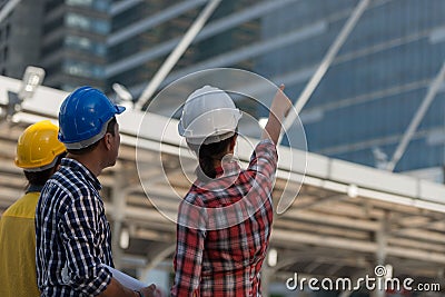 Asian engineers group consult construction on site building work Stock Photo