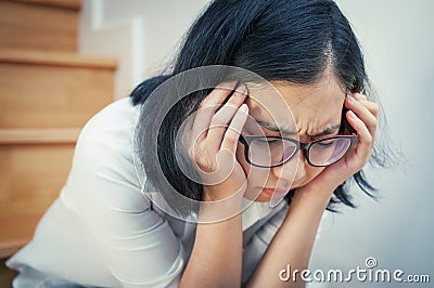 Asian eyeglasses girl tired from her work. Stock Photo