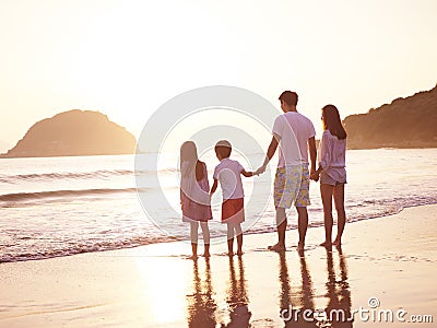 Asian family on beach Stock Photo