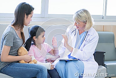 Asian family consult with doctor at hospital Stock Photo