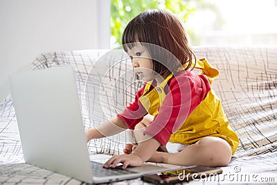Asian family, happy time at home, cute, adorable toddler, standing, innocently touching Stock Photo