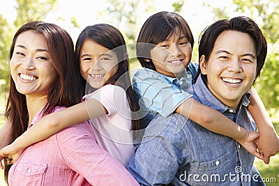 Asian family head and shoulders portrait outdoors Stock Photo