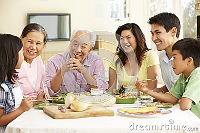 Asian family sharing meal at home Stock Photo