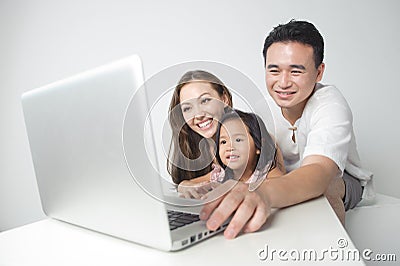 Asian family using the laptop Stock Photo