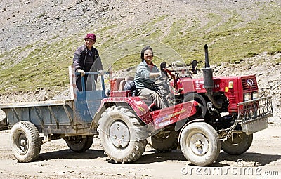 Asian farmer drives tractor Editorial Stock Photo