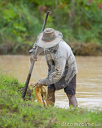 Asian farmer preparing the ground Stock Photo