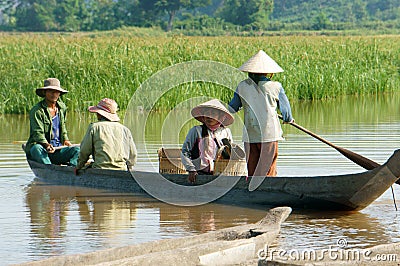 Asian farmer, row boat, family, go to work Editorial Stock Photo