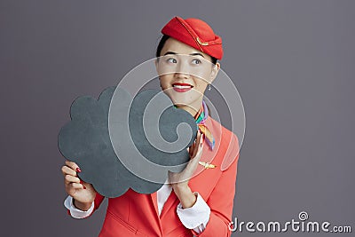 asian female air hostess showing blank cloud shape board Stock Photo