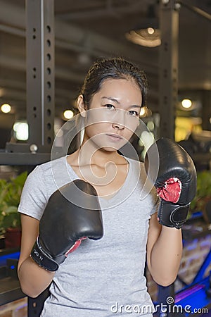 Asian female boxer practicing boxing Stock Photo