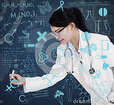 Asian female doctor drawing on transparent screen Stock Photo