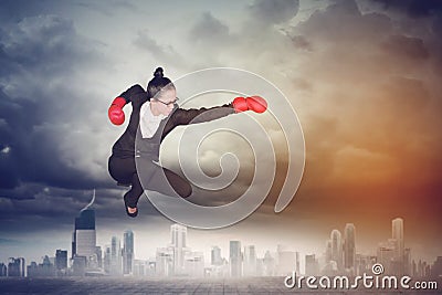 Asian female entrepreneur with boxing gloves Stock Photo