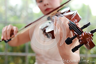 Asian female musicians playing the violin Stock Photo