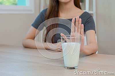 Asian female resistance deny drinking milk, symptom lactose allergy, concept of health problem, stop milk type drink, women Stock Photo