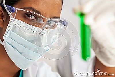 Asian Female Scientist Medical Research Lab with Test Tube of Green Solution Stock Photo