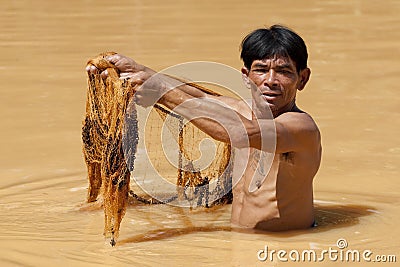 Asian fisherman with throw net Stock Photo