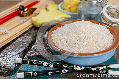 Asian food background. Sushi and rolls preparation. Making sushi Stock Photo