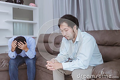 Asian gay couples are quarreling, angry or sad on sofa in home, LGBTQ concept. Stock Photo