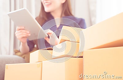 Girl is addicted to online shopping, full of deliveries boxes Stock Photo