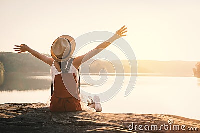 Asian girl backpack in nature during sunset Stock Photo