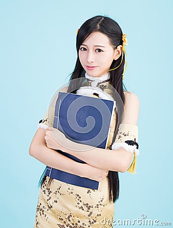 Asian girl in cheongsam qipao with chinese book Stock Photo